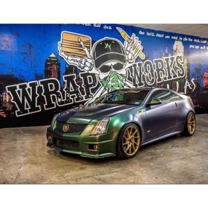 Cadillac wrapped in Avery ColorFlow Satin Urban Jungle Silver/Green shade shifting vinyl