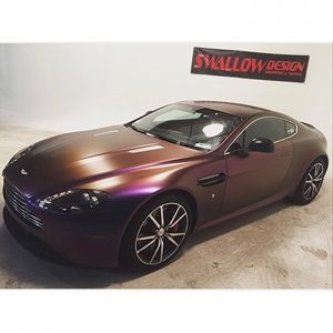 Aston Martin wrapped in Avery ColorFlow Satin Rushing Riptide Cyan/Purple shade shifting vinyl