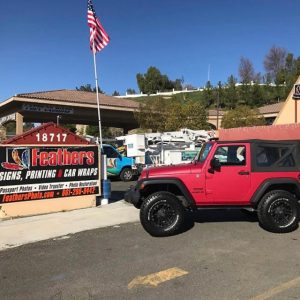 Jeep wrapped in Matte Red Metallic vinyl