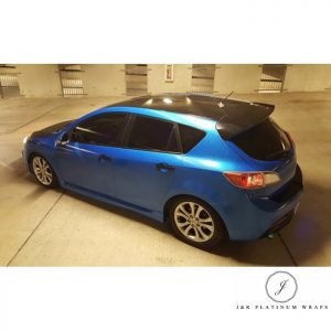 Mazda 3 wrapped in Metallic Diamond Blue vinyl