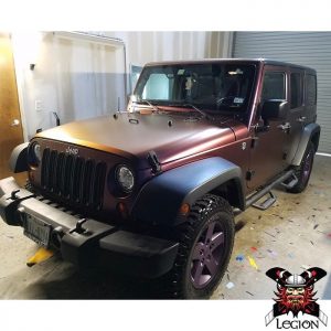 Jeep wrapped in Avery ColorFlow Satin Roaring Thunder Blue/Red shade shifting vinyl