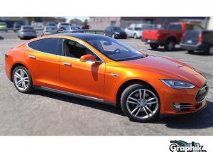 Tesla wrapped in 1080 Gloss Fiery Orange vinyl