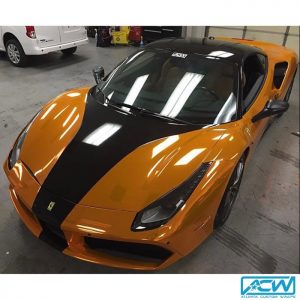 Ferrari wrapped in Avery Gloss Black and Silver Chrome overlaminated with SF100 Orange transparent vinyl