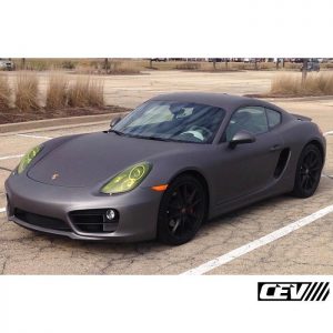 Porsche wrapped in Avery SW Matte Charcoal Metallic vinyl with headlamps wrapped in Orafol 8300 Transparent Brimstone Yellow vinyl
