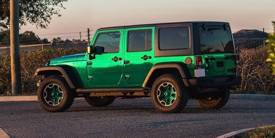Jeep wrapped in Avery SW Silver Chrome overlaminated with Avery SF100 Transparent Green vinyl