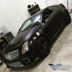 Cadillac wrapped in Avery SW Satin Black vinyl