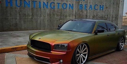 Dodge wrapped in Avery ColorFlow Satin Rising Sun Red/Gold shade shifting vinyl