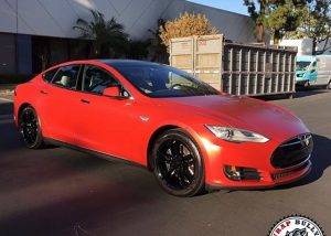 Tesla wrapped in 1080 Satin Smoldering Red vinyl
