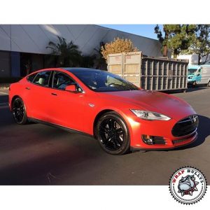 Tesla wrapped in 1080 Satin Smoldering Red vinyl