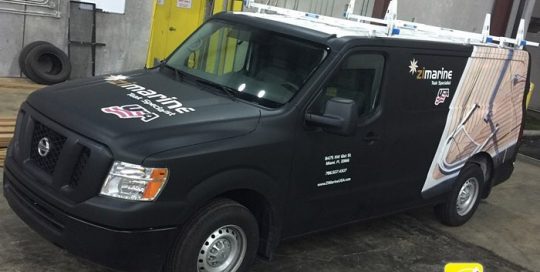 Nissan wrapped in 1080 Matte Black and custom printed 3M IJ 180C vinyls