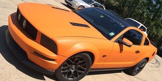 Ford Mustang wrapped in Avery SW Matte Orange vinyl