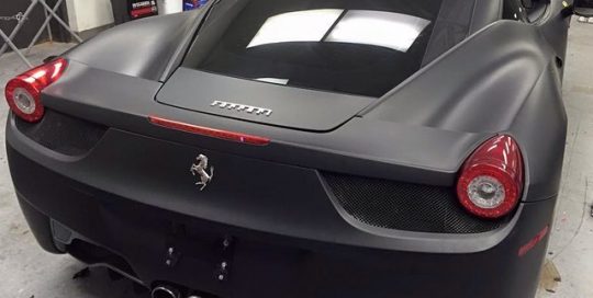 Ferrari wrapped in 3M 1080 Matte Deep Black vinyl