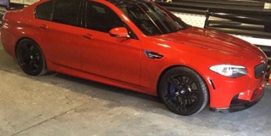 BMW wrapped in Gloss Dragon Fire Red vinyl