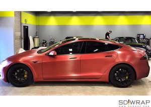 Tesla wrapped in Arlon UPP Brushed Red Aluminum vinyl