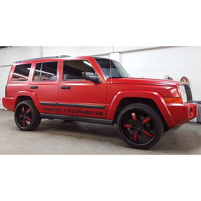 Jeep wrapped in Avery Satin Carmine Red vinyl
