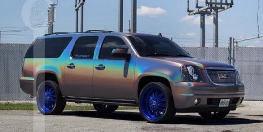 GMC wrapped in 3M ColorFlip Gloss Psychedelic shade shifting vinyl