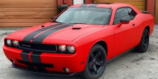 Dodge Challenger wrapped in Matte Red and Brushed Steel vinyls