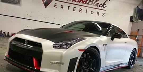 Nissan wrapped in Avery Satin Pearl White and Satin Black vinyls