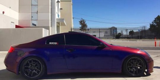 Infiniti wrapped in Avery ColorFlow Gloss Roaring Thunder Blue/Red shade shifting vinyl