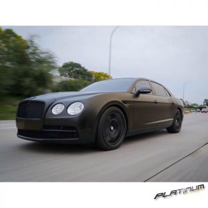 Bentley wrapped in 1080 Satin Gold Dust Black vinyl