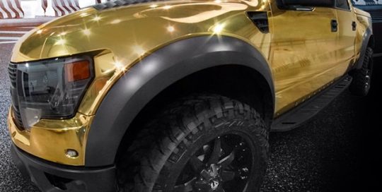 Ford Raptor wrapped in Avery gold chrome vinyl