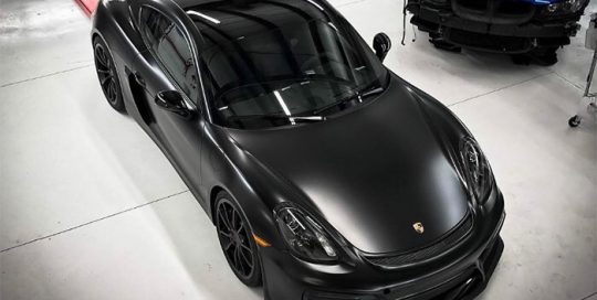 Porsche Cayman wrapped in Avery SW Satin Black and Gloss Black vinyls