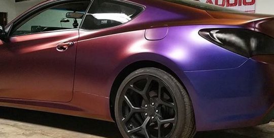 Hyundai Genesis wrapped in Avery ColorFlow Satin Roaring Thunder Blue/Red shade shifting vinyl