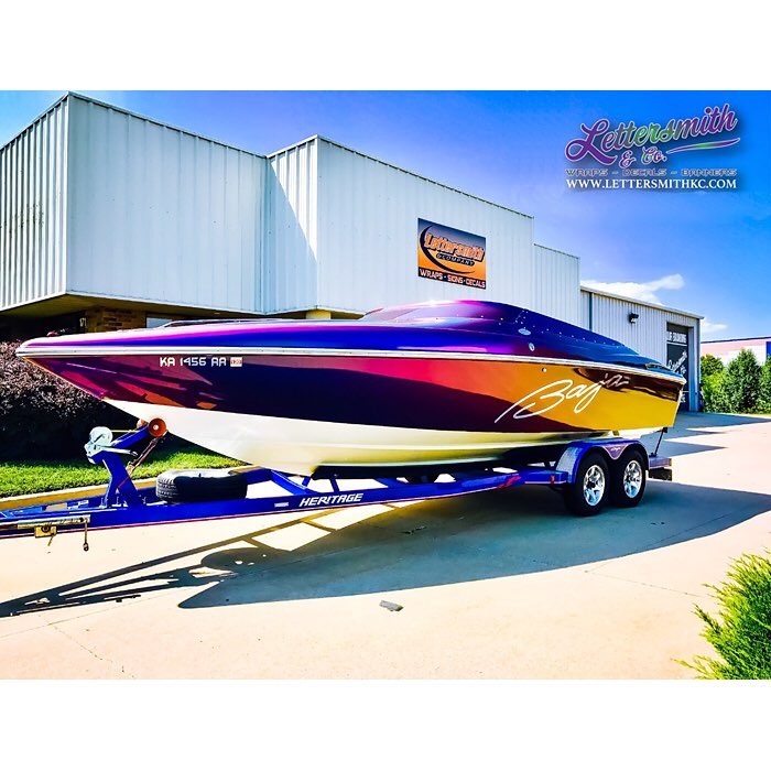 Baja Boat wrapped in Avery ColorFlow Gloss Lightning Ridge Green/Purple shade shifting vinyl