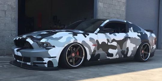 Ford Mustang wrapped in custom printed camouflage on Avery 1105EZRS vinyl with 1370z Luster overlaminate