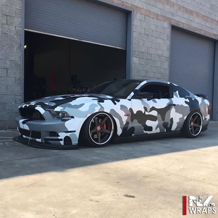 Ford Mustang wrapped in custom printed camouflage on Avery 1105EZRS vinyl with 1370z Luster overlaminate