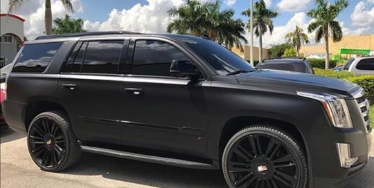 Cadillac Escalade wrapped in Satin Black vinyl