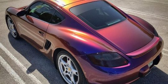 Porsche Cayman wrapped in Avery ColorFlow Gloss Roaring Thunder Blue/Red shade shifting vinyl