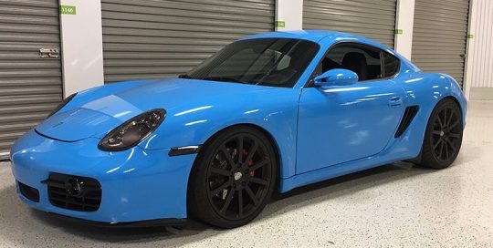 Porsche Cayman wrapped in Avery SW Gloss Light Blue vinyl