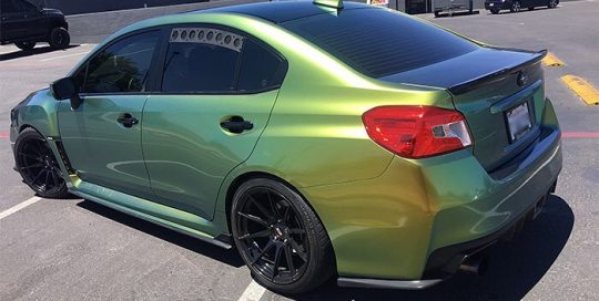 Subaru WRX wrapped in Avery Gloss Fresh Spring Gold/Silver shade shifting vinyl