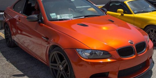 BMW M3 wrapped in Gloss Fiery Orange vinyl