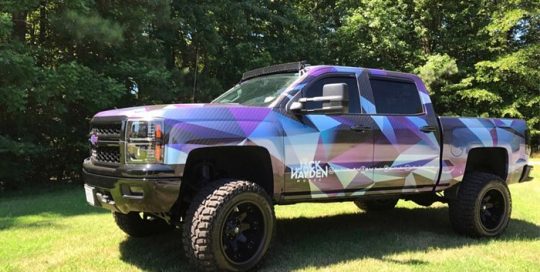 Chevrolet Silverado wrapped in custom printed 3M IJ180mC-120 Metallic Satin White Aluminum vinyl