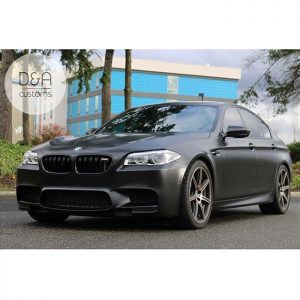 BMW M5 wrapped in Avery SW Satin Black vinyl