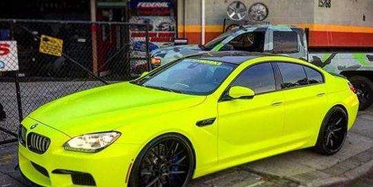 BMW M6 wrapped in Satin Neon Fluorescent Yellow vinyl