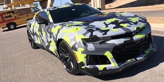 Chevrolet Camaro wrapped in custom printed camo on Avery 1105EZRS vinyl with 1380z Matte overlaminate