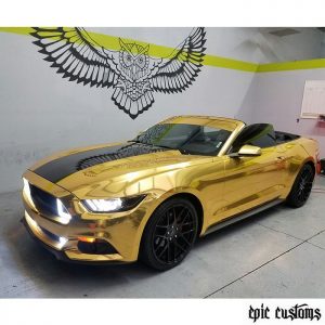 Ford Mustang wrapped in Avery SW Gold Chrome vinyl