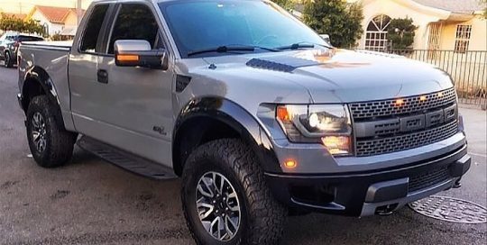 Ford Raptor wrapped in Avery SW Gloss Dark Grey vinyl