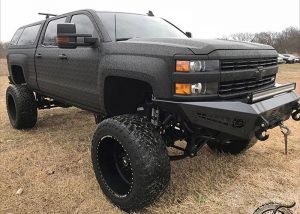 Chevrolet 2500 wrapped in Shadow Black vinyl