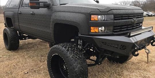 Chevrolet 2500 wrapped in Shadow Black vinyl