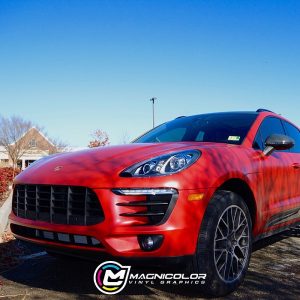 Porsche Macan wrapped in Satin Smoldering Red vinyl