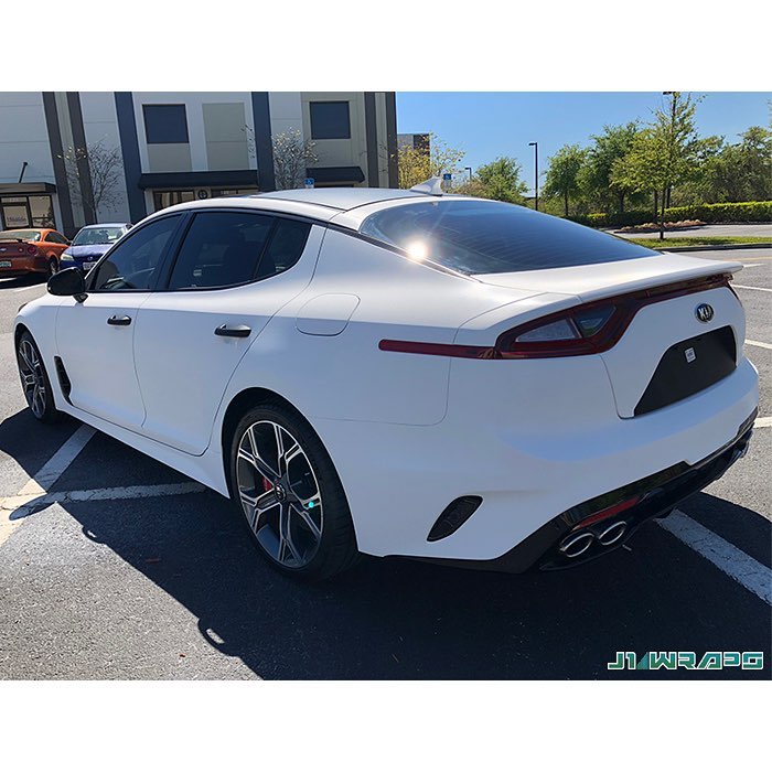 Kia Stinger wrapped in White Carbon Fiber vinyl
