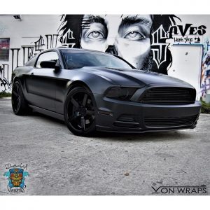 Ford Mustang wrapped in Avery SW Satin Black vinyl