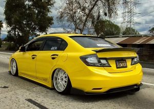 Honda Civic wrapped in Avery SW Gloss Yellow vinyl