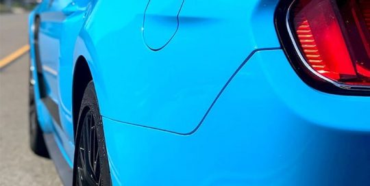 Ford Mustang wrapped in Avery SW Gloss Light Blue vinyl