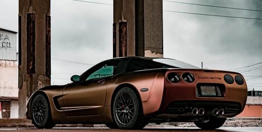 Chevrolet Corvette wrapped in Avery ColorFlow Satin Rising Sun Red/Gold shade shifting vinyl