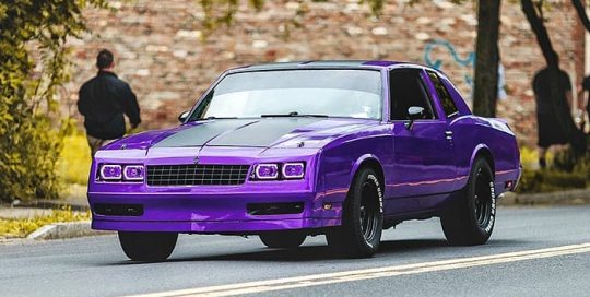 Chevrolet Montecarlo wrapped in Gloss Plum Explosion vinyl